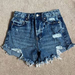 Wild Fable medium to dark wash denim shorts in a size 0 for sale!
